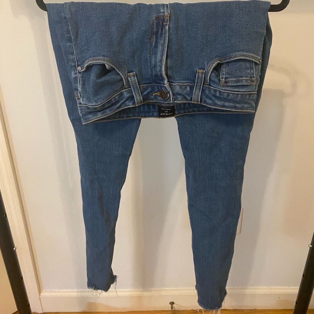 Just black NY jeans with rips in the knee